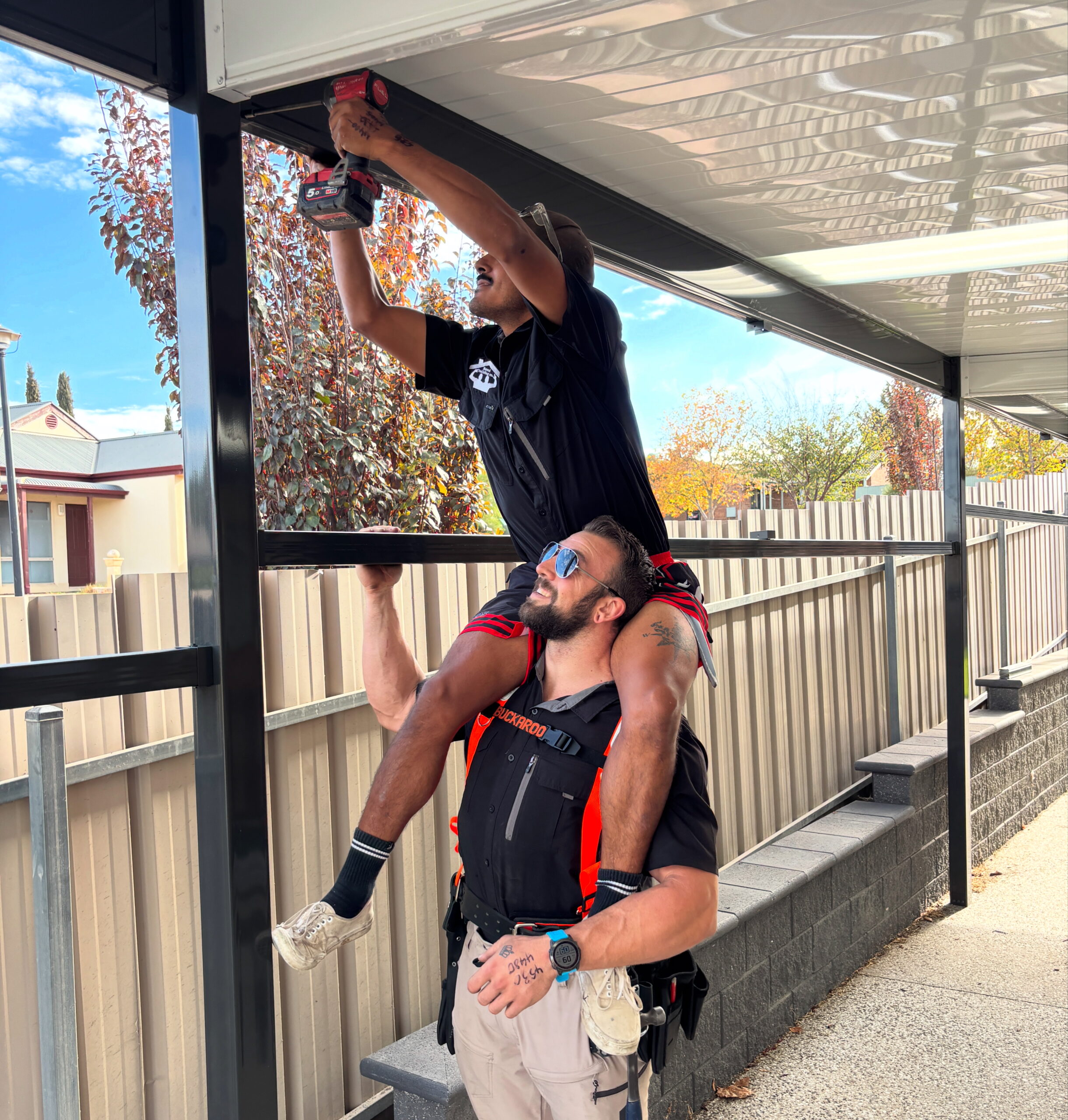 Roofing, cladding, guttering & verandahs Adelaide – full service home upgrade by Menzel Building Co. Apprentice and Director working on site.