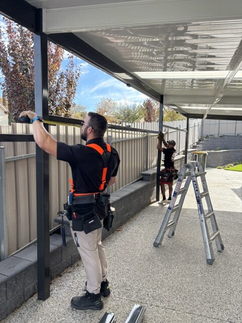 Tim and apprentice Israel on-site delivering high-quality roofing and outdoor services with attention to detail and craftsmanship.